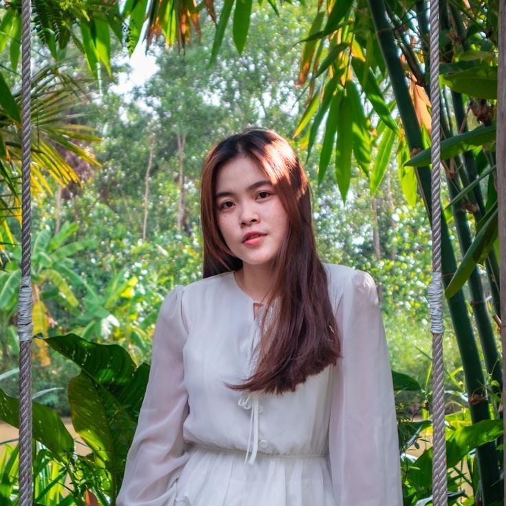 Kaveri Mehta, Lead Design Curator at GroveLedgerStudio, reviewing corporate floral arrangements